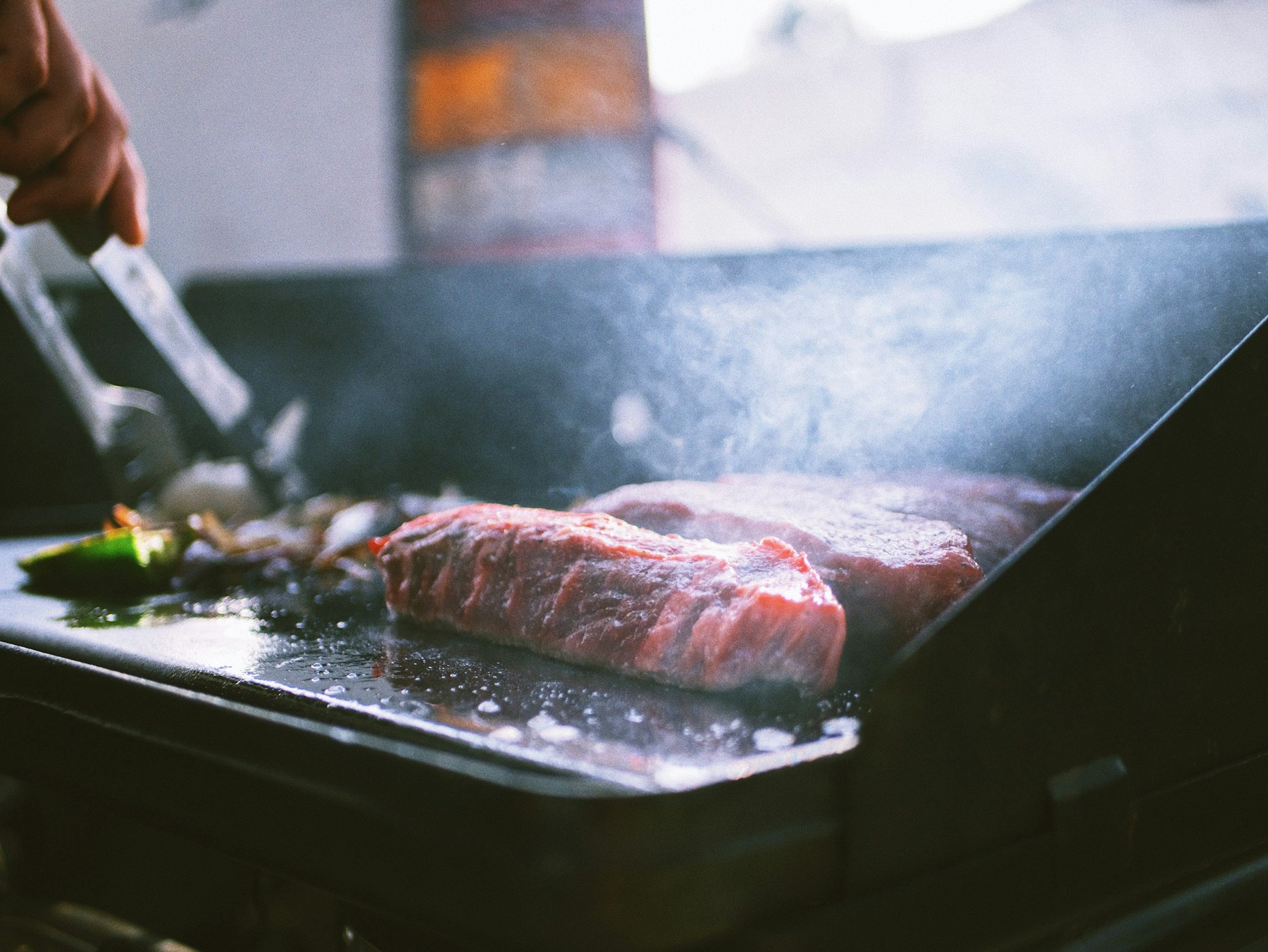 Steak searing on the flat-top griddle