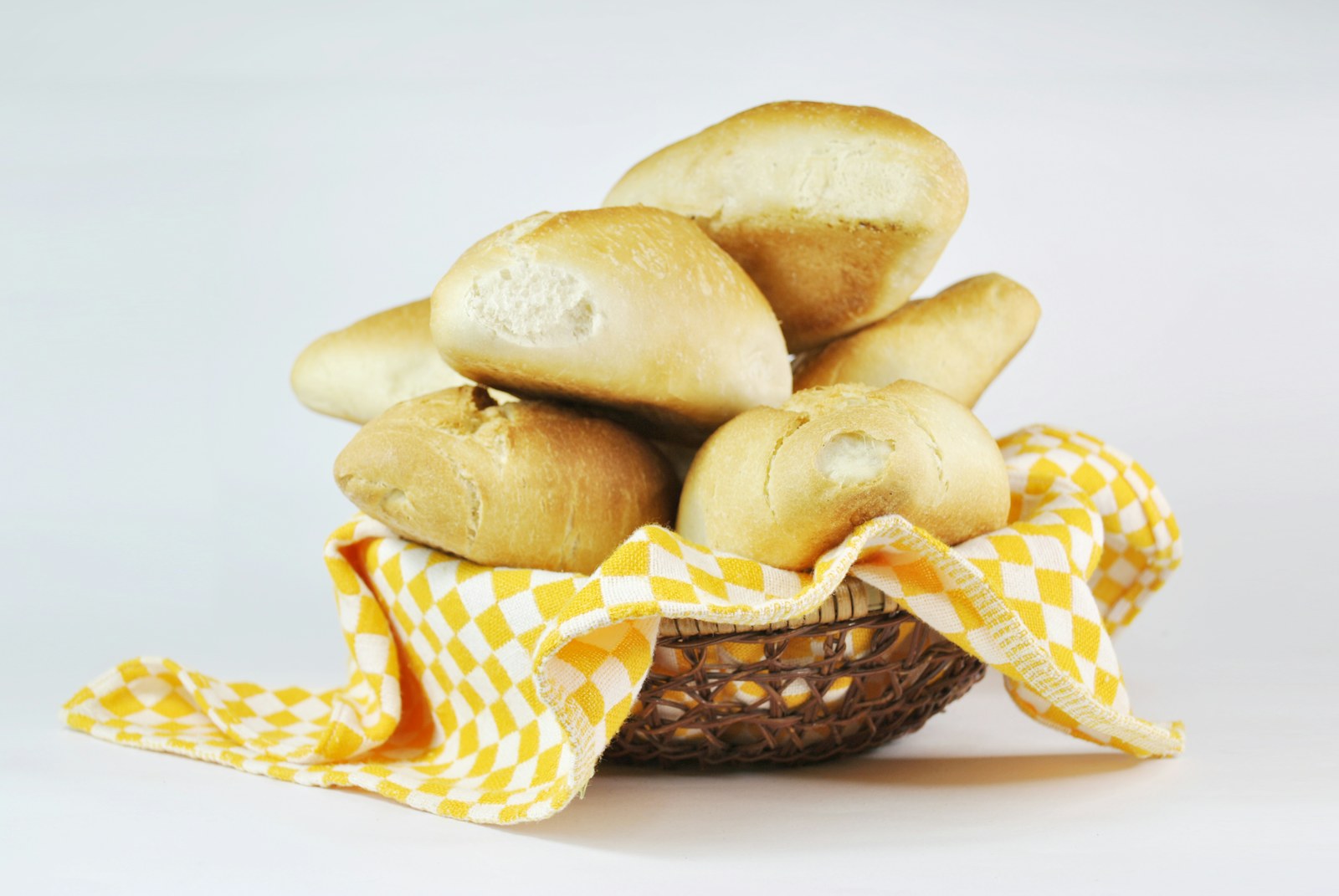 Soft bread rolls in a basket lined with a cloth
