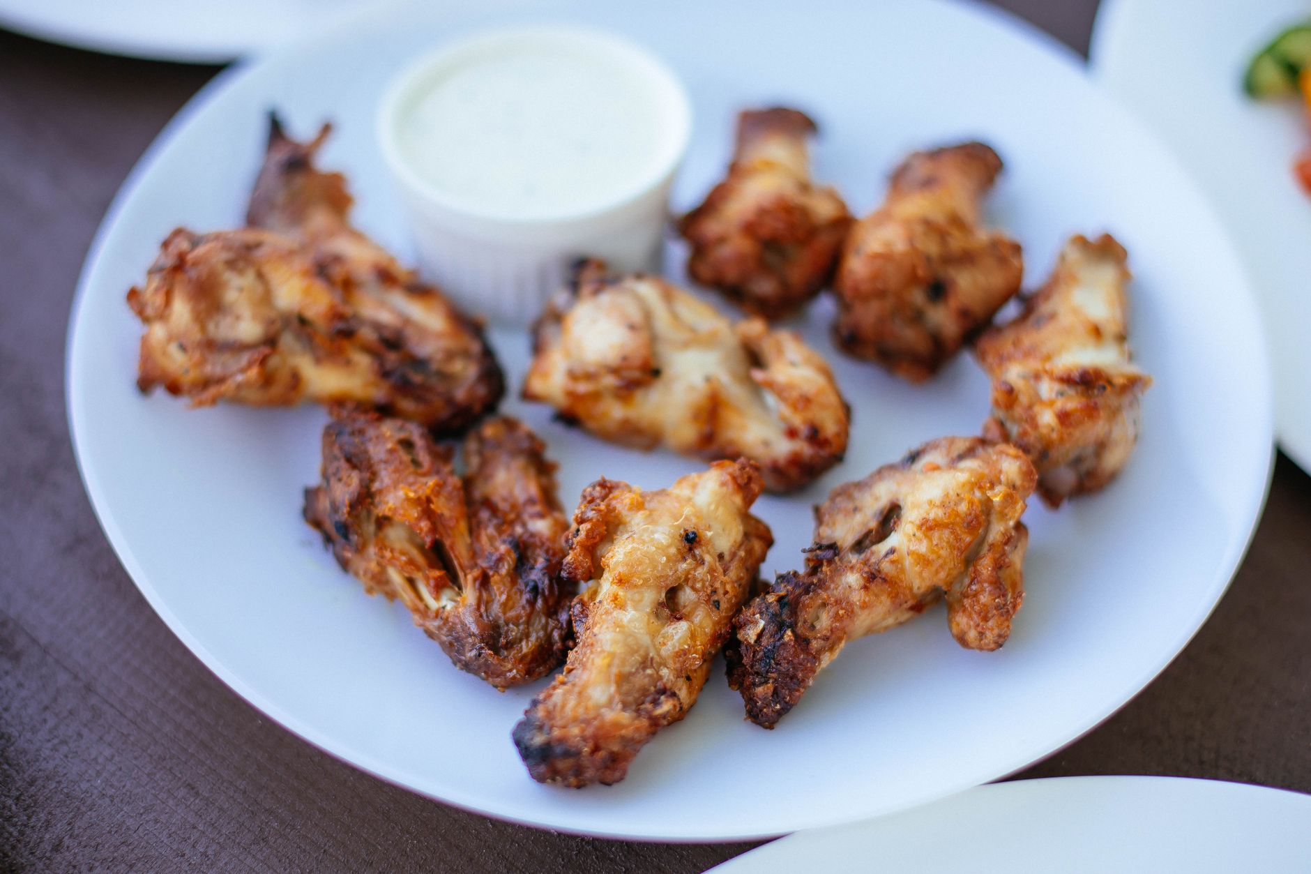 Fried chicken wings showing both drumettes and flats