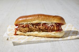 Meatball sub with marinara and melted cheese in a long roll