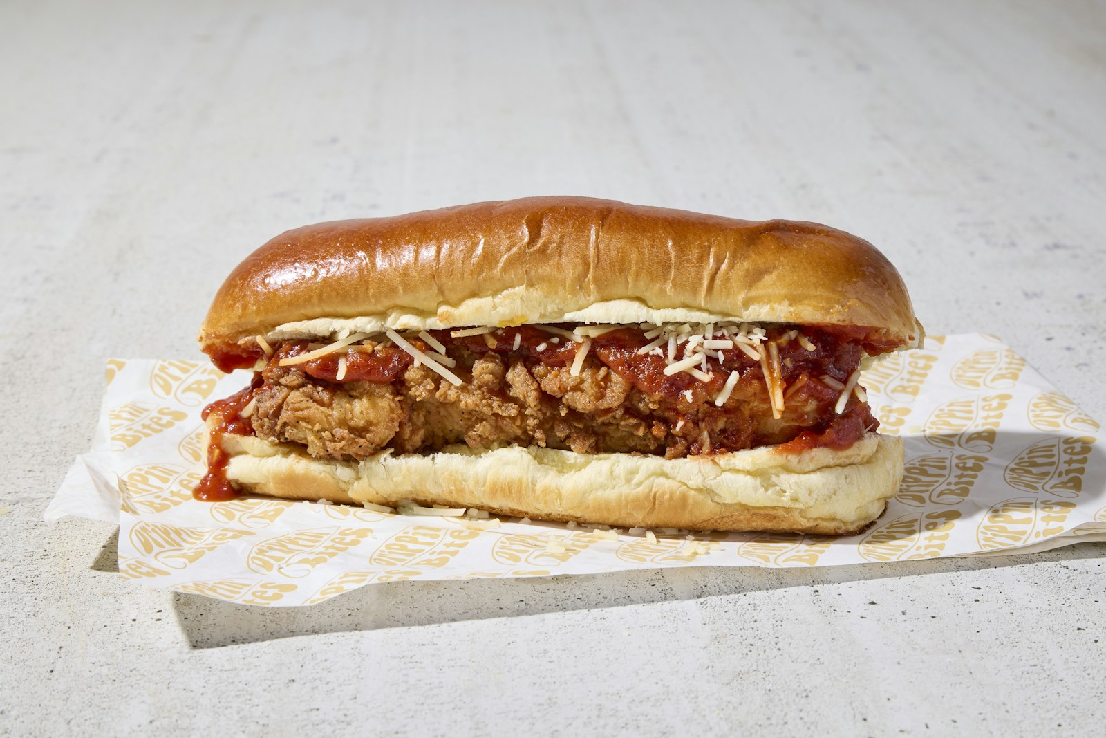 Meatball sub with marinara and melted cheese in a long roll