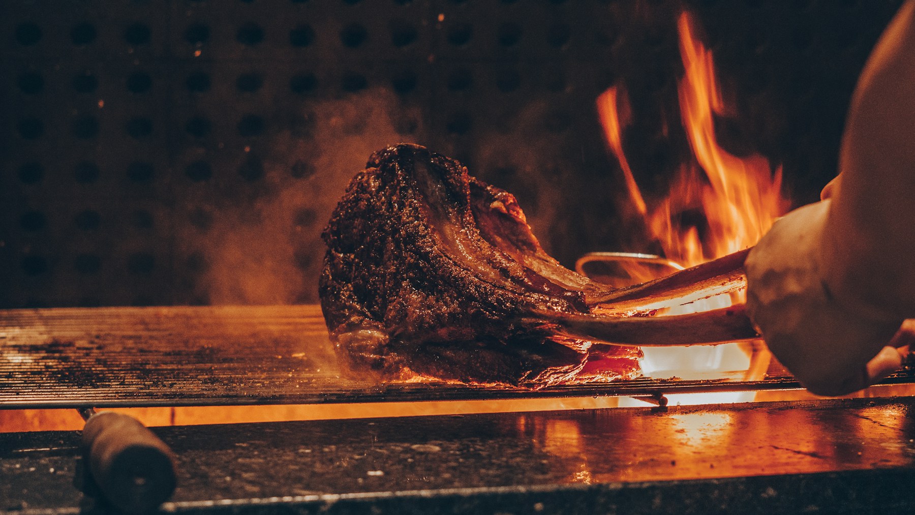 Steak searing over an open flame