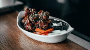 Sauced chicken wings in a bowl