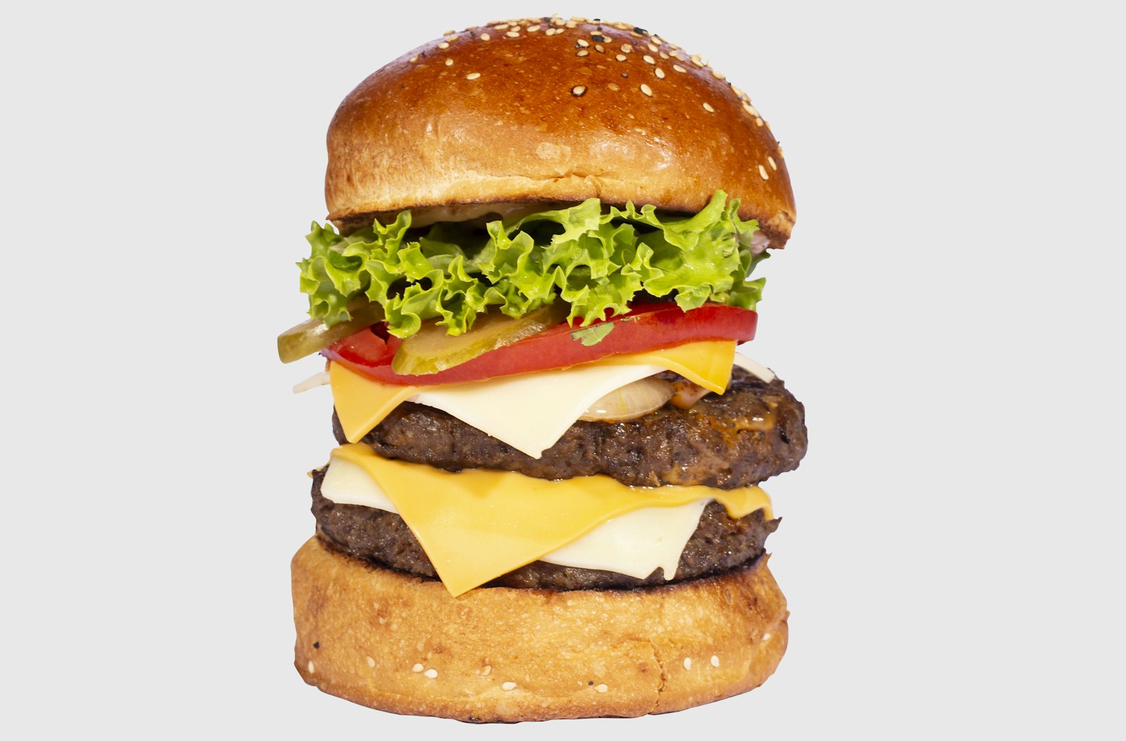 Double cheeseburger with lettuce, tomato and pickles