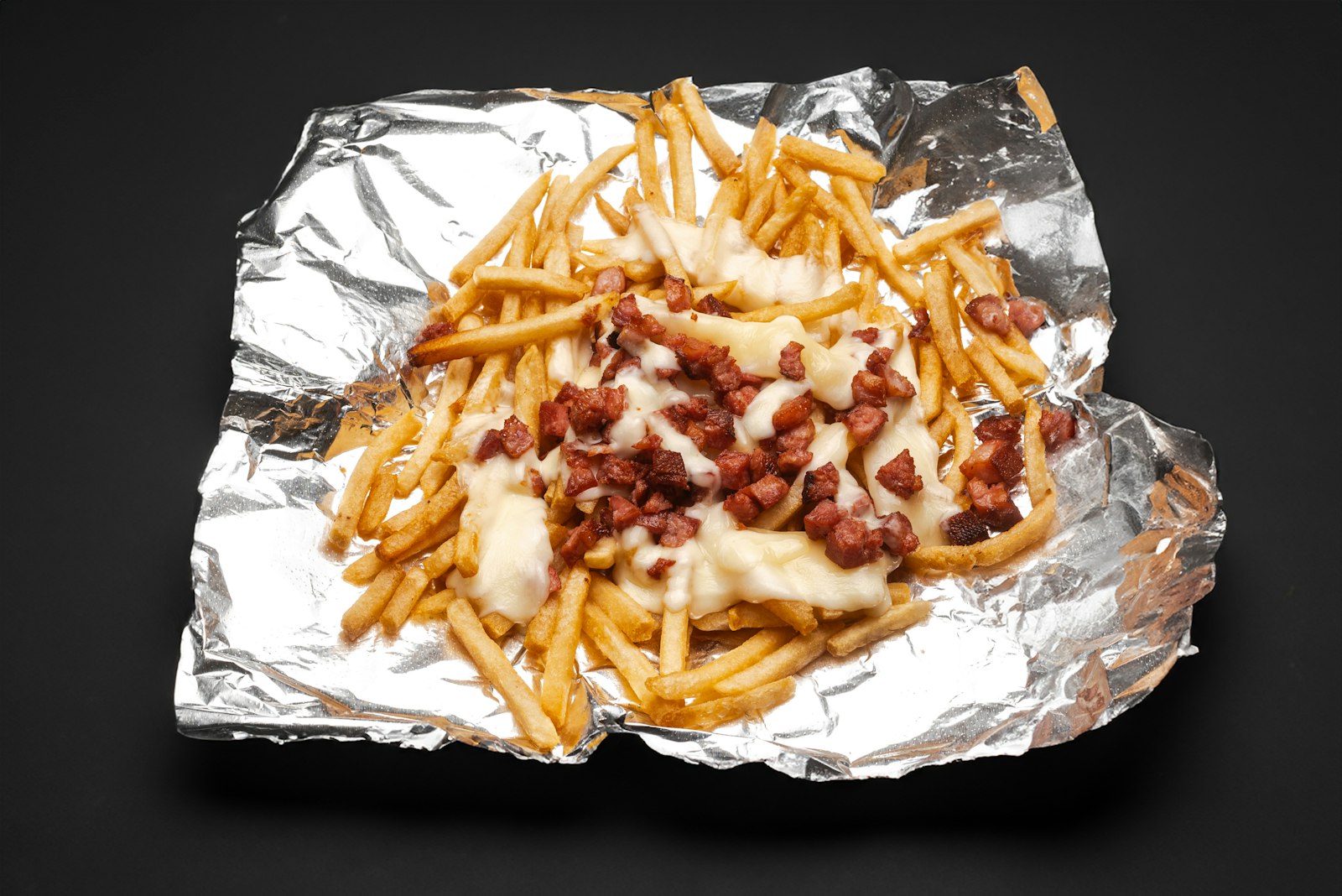 Loaded fries with bacon, cheese and jalapenos