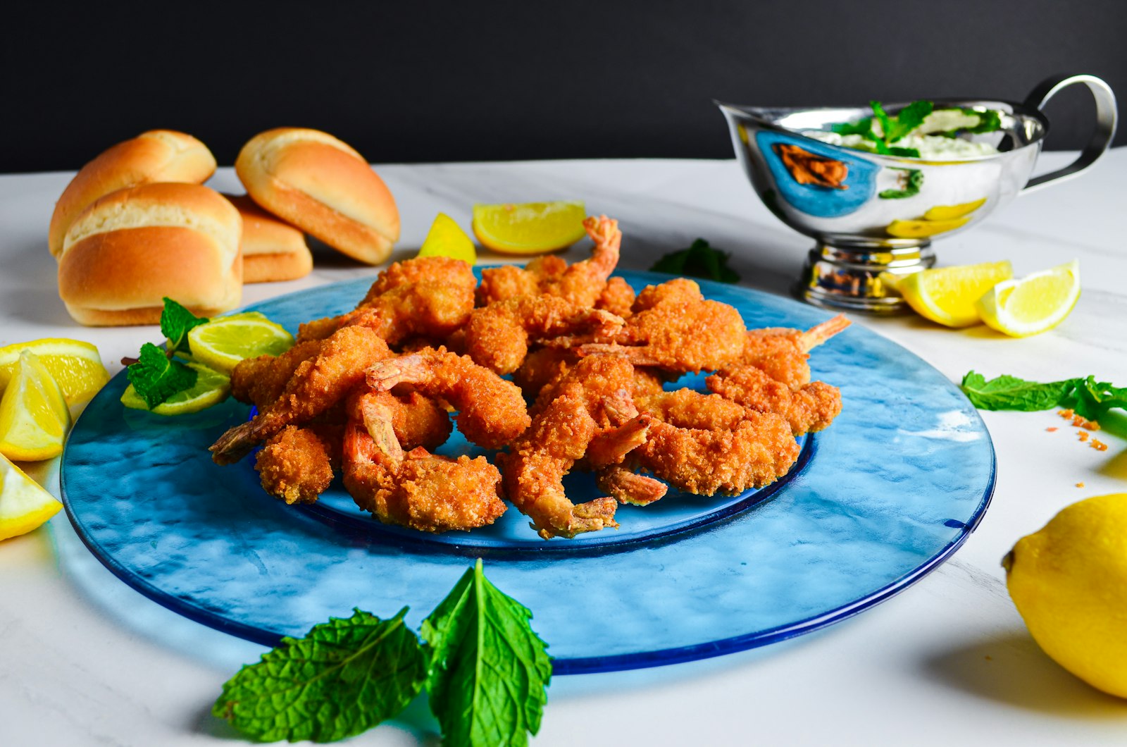 Fried shrimp po'boy dressed with lettuce and tomato
