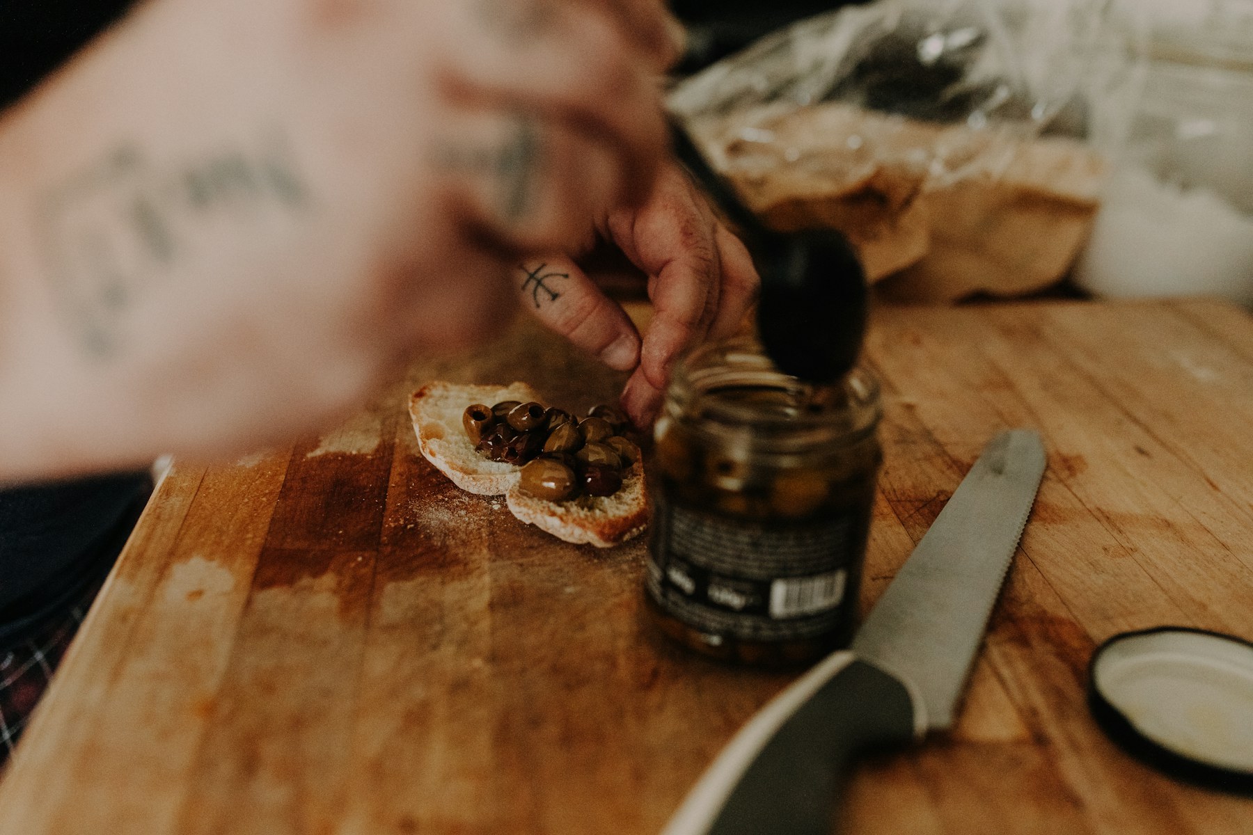 Hands building a dish on a wooden board